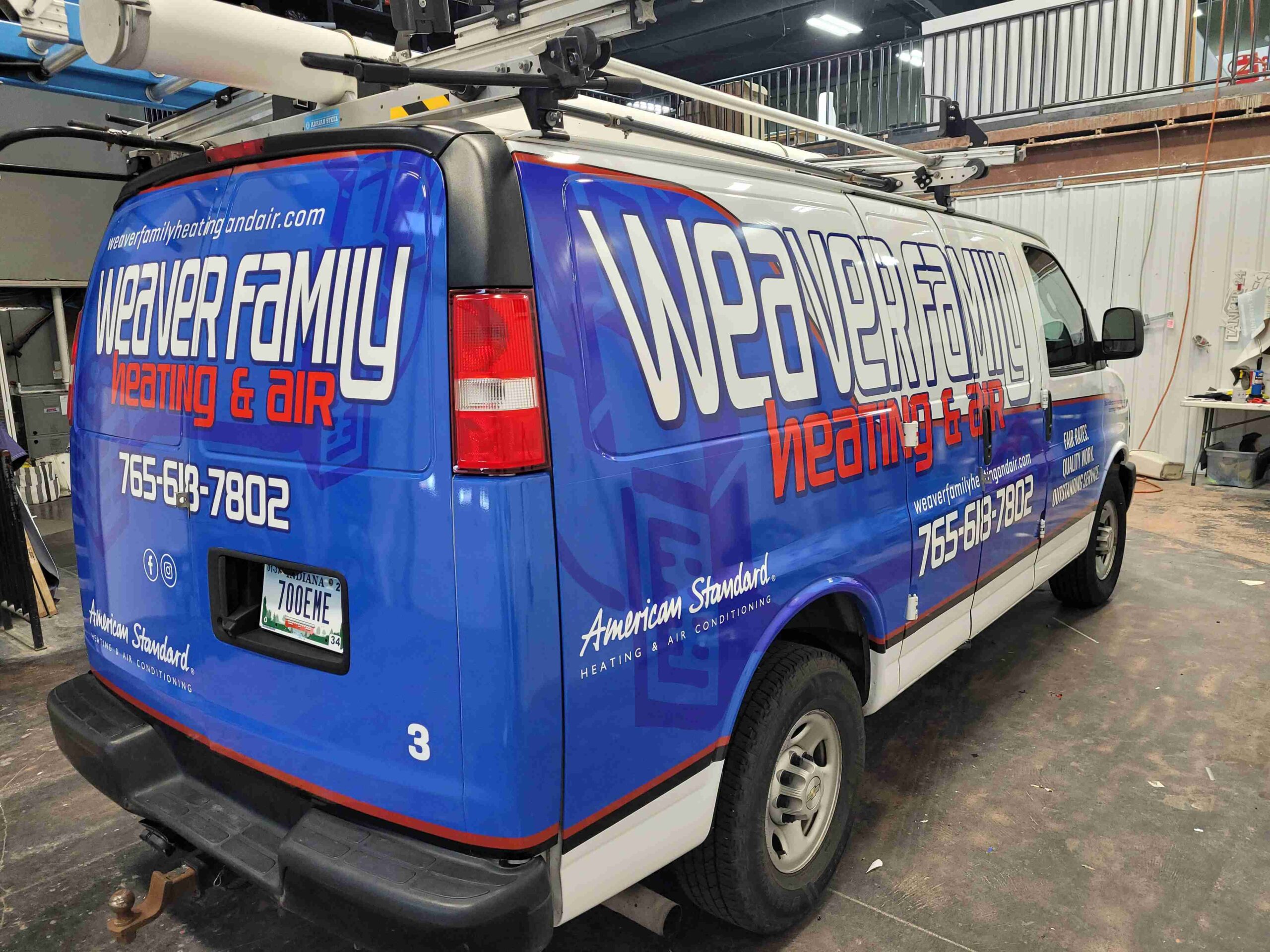 Rear passenger side view Weaver Family Heating Air vehicle graphics contact information